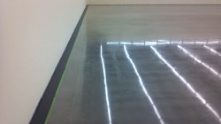 Polished concrete with painted border.