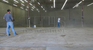 Concrete floor sealing with a penetrating densifier will harden and dustproof concrete floors in warehouses and manufacturing plants. 