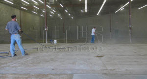 Concrete floor sealing with a penetrating densifier will harden and dustproof concrete floors in warehouses and manufacturing plants. 