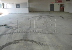 Tire marks in concrete floor increase cleaning cost. 